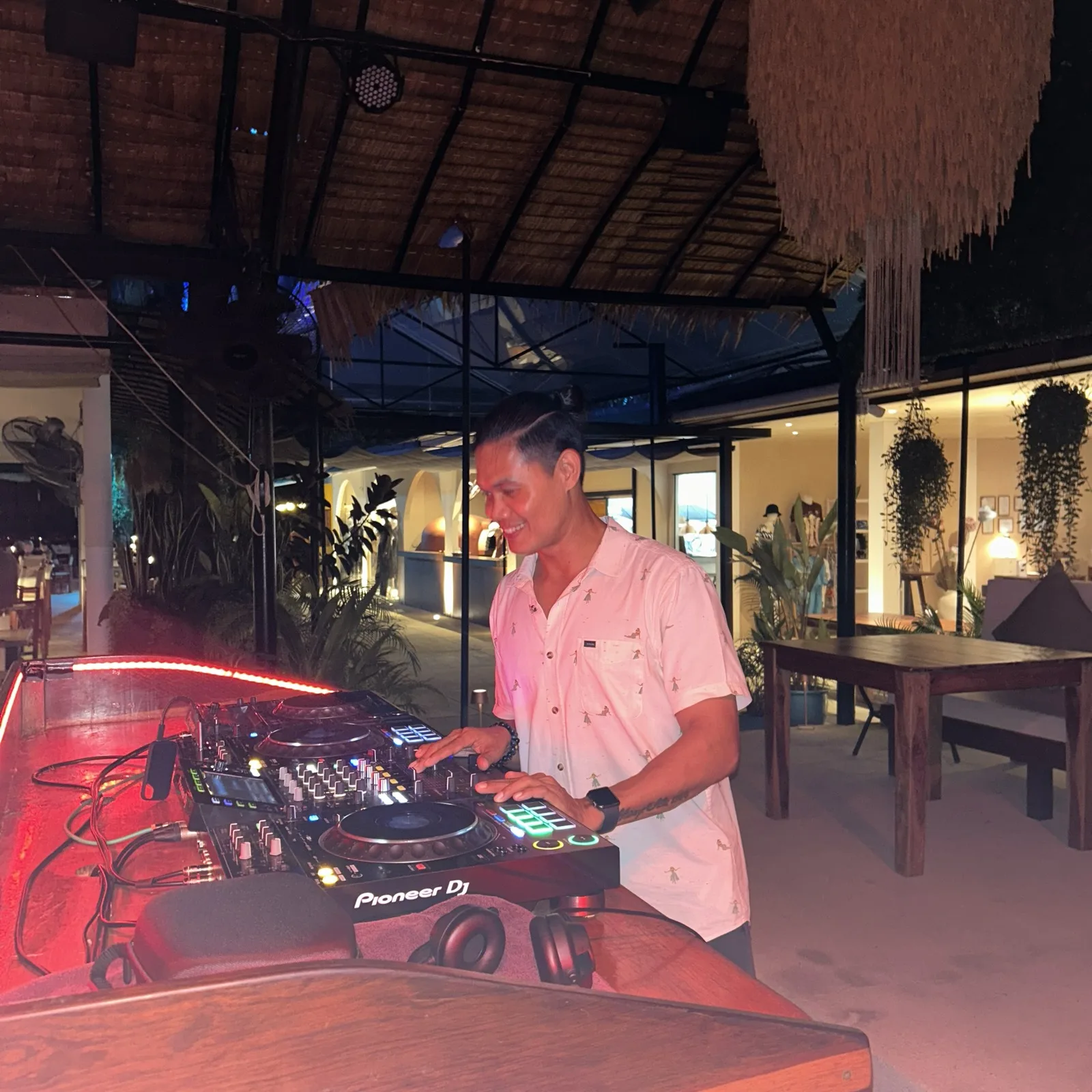 Anish from the COR team DJing behind Pioneer decks at Carpe Diem in Phuket