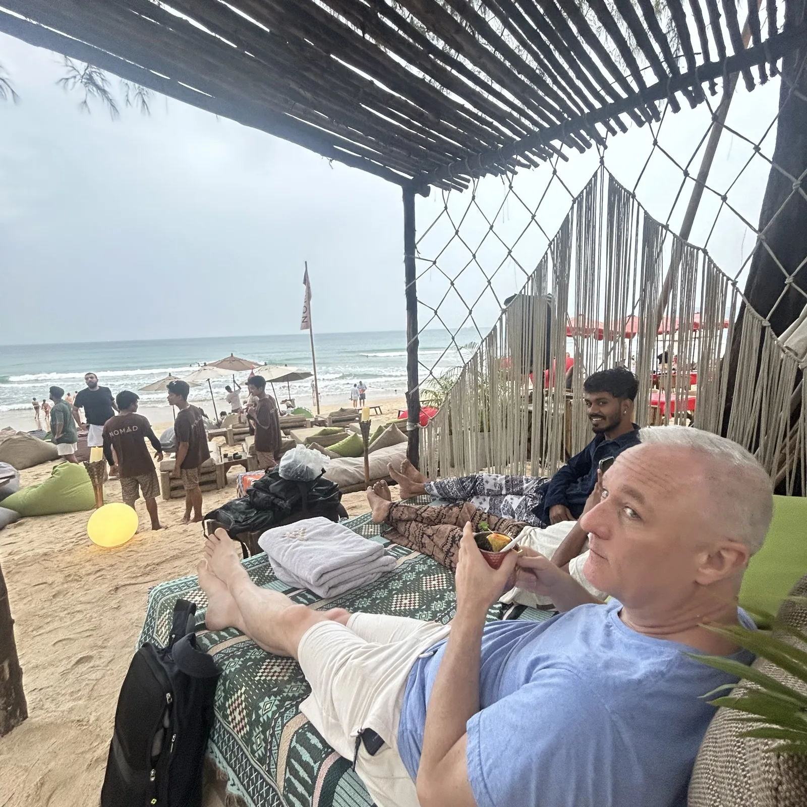 Nomad Beach Club in Phuket with beanbags on the sand and the sea beyond
