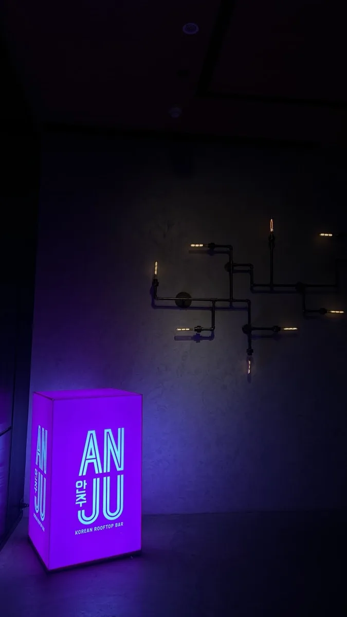 Korean BBQ on a Bangkok rooftop at Anju with the ANJU neon sign glowing
