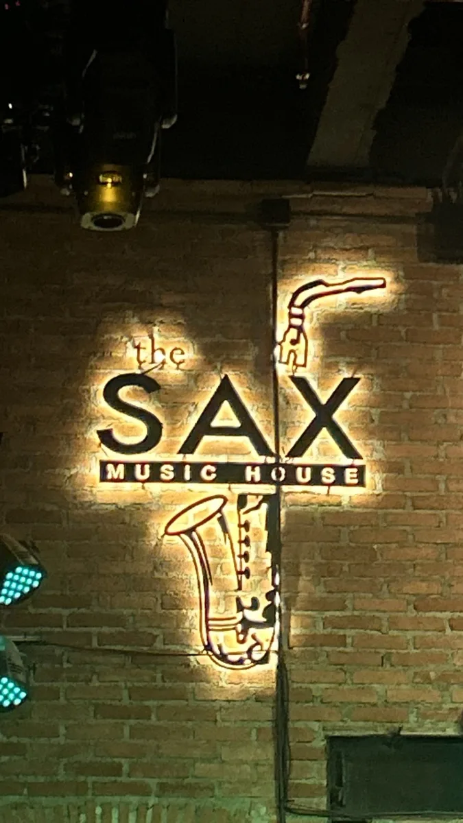 The neon sign of Sax Music Bar in Chiang Mai at night